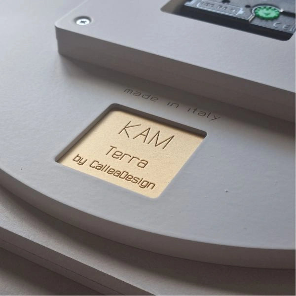 Back of the KAM Terra wall clock with engraved name, CalleaDesign signature and Made in Italy detail